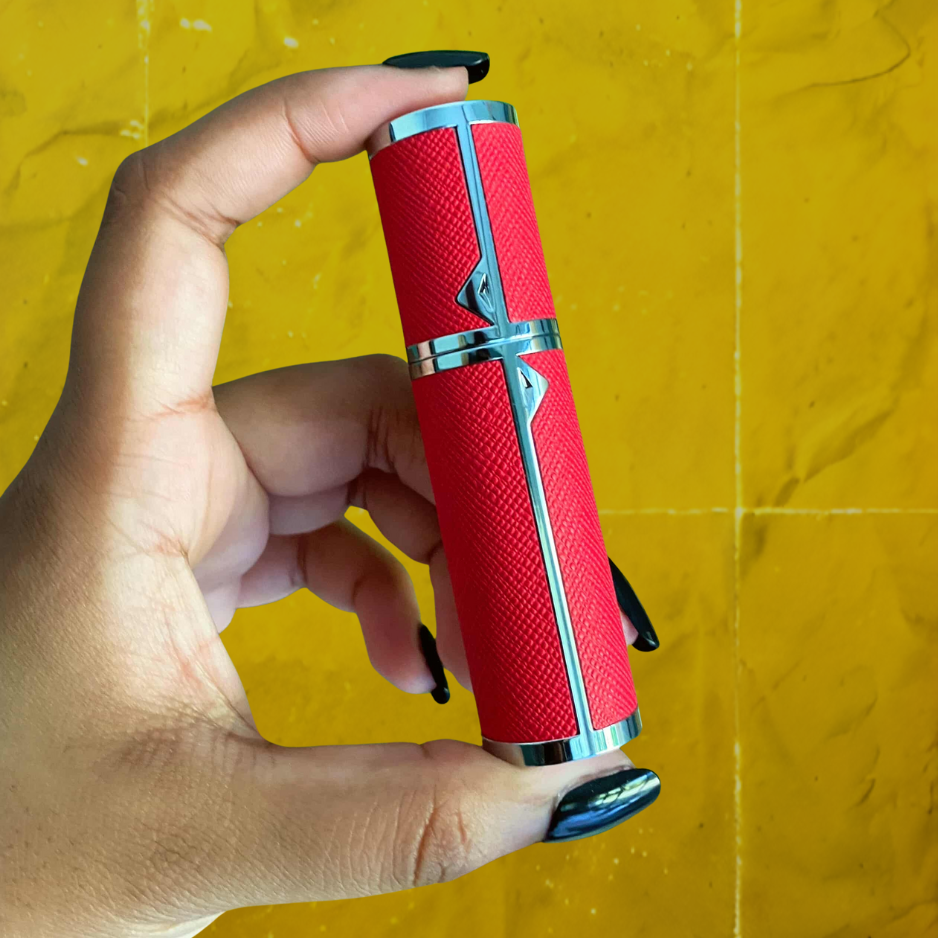 SPRITZ Hepburn refillable perfume atomizer — in hand, red