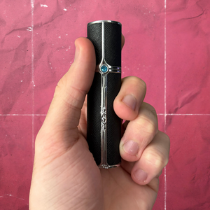 SPRITZ Olivier refillable perfume atomizer black/silver— premium blue gem - in hand