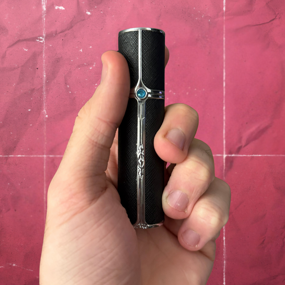 SPRITZ Olivier refillable perfume atomizer black/silver— premium blue gem - in hand
